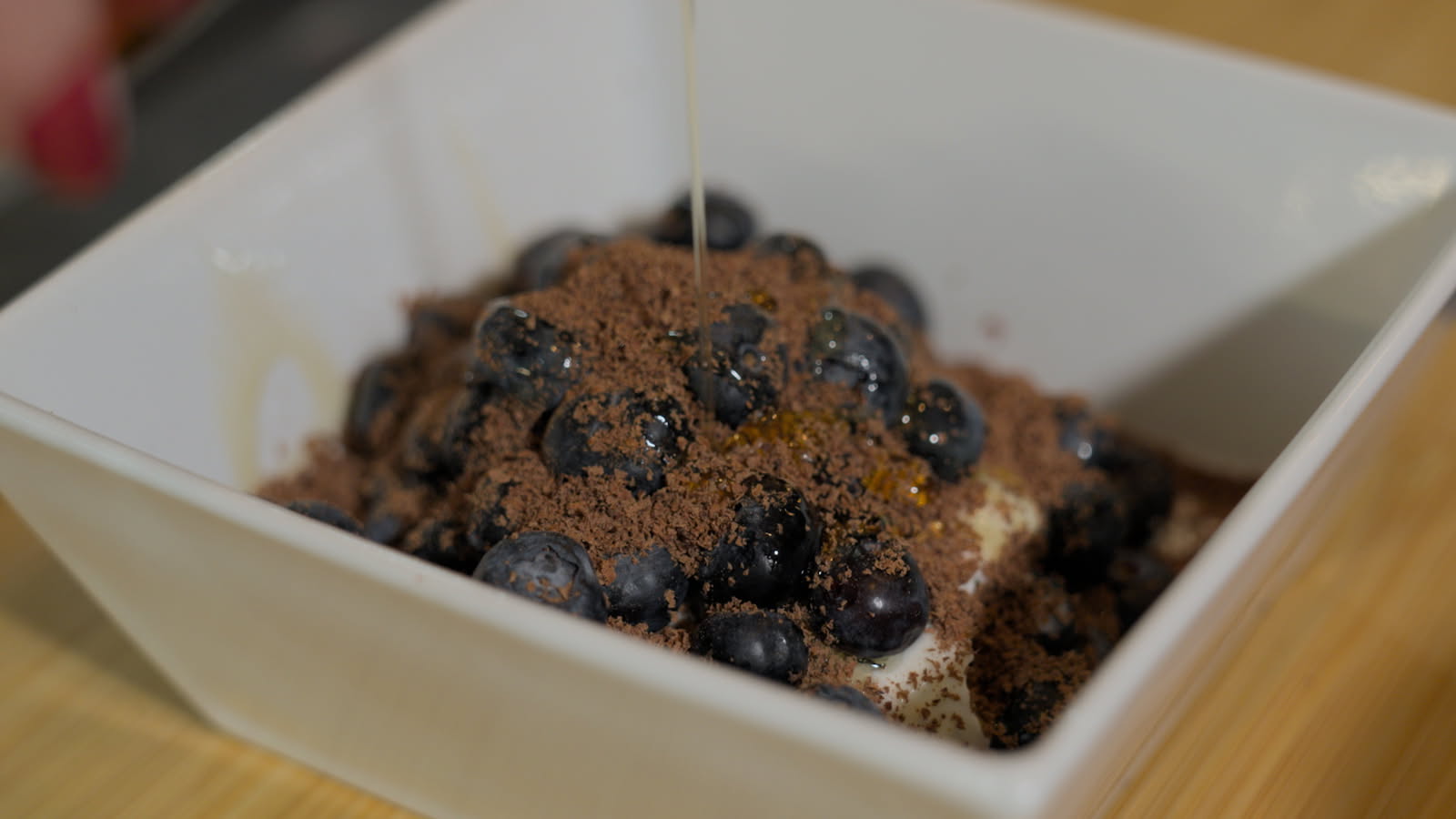 Pure cacao, shaved over blueberries and cream.